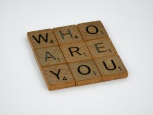 block tiles saying "who are you"